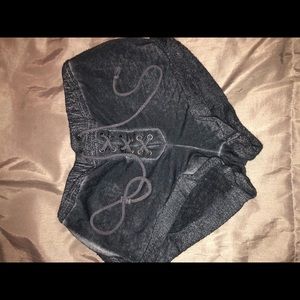 Super soft lace up shorts.